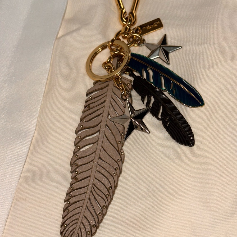 Coach Gold and Gray Feather Keychain with Star Charm